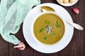 Vegetable cream soup with spinach and potatoes in a white bowl with garlic croutons Royalty Free Stock Photo