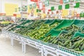 Vegetable department with a wide selection in a large supermarket. Vegetarianism and a healthy lifestyle