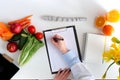 Vegetable diet nutrition and medication concept. Nutritionist offers healthy vegetables diet Royalty Free Stock Photo