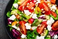 Vegetable dish, salad with avocado, pepper, tomato, italian mix, fresh lettuce, feta cheese and pine nuts. Healthy food Royalty Free Stock Photo