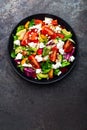 Vegetable dish, salad with avocado, pepper, tomato, italian mix, fresh lettuce, feta cheese and pine nuts. Healthy food Royalty Free Stock Photo