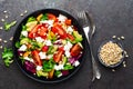 Vegetable dish, salad with avocado, pepper, tomato, italian mix, fresh lettuce, feta cheese and pine nuts. Healthy food Royalty Free Stock Photo