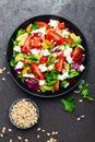 Vegetable dish, salad with avocado, pepper, tomato, italian mix, fresh lettuce, feta cheese and pine nuts. Healthy food Royalty Free Stock Photo