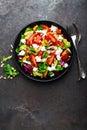 Vegetable dish, salad with avocado, pepper, tomato, italian mix, fresh lettuce, feta cheese and pine nuts. Healthy food Royalty Free Stock Photo