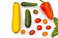 Vegetable flatlet: cucumbers, zucchini, cherry tomatoes, a sprig of basil and peppers on a white plate. Royalty Free Stock Photo