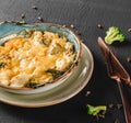 Vegetable Frittata with potato, broccoli, cheese in plate over dark background. Healthy vegan food, clean eating, dieting