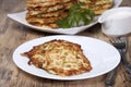 Vegetable fritters of zucchini with parsley and dill closeup . Royalty Free Stock Photo