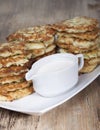 Vegetable fritters of zucchini with parsley and dill closeup .