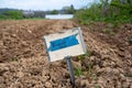 Vegetable garden broccoli metal row sign in freshly tilled soil Royalty Free Stock Photo