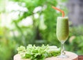Vegetable juice smoothie summer and fresh celery stalk on wooden board with nature green Royalty Free Stock Photo