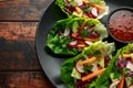 Vegetable lettuce wraps with carrot, onion, radish, red cabbage, cucumber and sweet chilli sauce