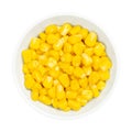 Sweet corn kernels, canned yellow vegetable maize, in a white bowl