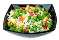 Vegetable mix in black salad bowl Royalty Free Stock Photo