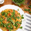 Vegetable omelette with pea shoots microgreens on white plate Royalty Free Stock Photo
