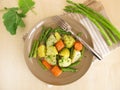Vegetable pan with green asparagus, carrots, potatoes and german turnip