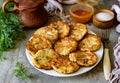 Vegetable pancakes on a beautiful plate for lunch for the whole family. Potato pancakes on a plate on a gray background