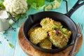 Vegetable pancakes. Fried vegetarian cutlets or fritters on a kitchen wooden table. Royalty Free Stock Photo