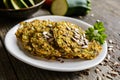 Vegetable pancakes with zucchini, carrot, chia, flax seeds and oatmeal Royalty Free Stock Photo