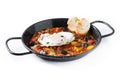 Vegetable pisto manchego with tomatoes, zucchini, peppers, onions,eggplant and egg, served in frying pan