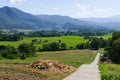 Vegetable plot and flowerbed with mountain and paddy view Royalty Free Stock Photo