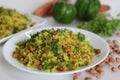 Vegetable Poha is a quick breakfast or snack made of beaten rice or flattened rice along peanuts, carrots and chilies Royalty Free Stock Photo