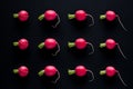 Group radishes on a black background like a vegetable pattern