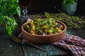 Vegetable roast eggplant and potatoes in a clay plate ketsa. Homemade healthy food in a rustic style