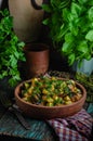 Vegetable roast eggplant and potatoes in a clay plate ketsa. Homemade healthy food in a rustic style