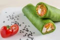 Vegetable rolls of pita. Bread rolls with vegetables inside. The pita bread wrapped cabbage, cucumber, feta cheese. The dish is de Royalty Free Stock Photo