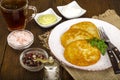 Vegetable rosti, golden fried potato pancakes with dips from cauliflower and sour cream