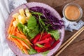 Vegetable salad with asian peanut coconut dressing