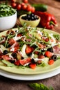 Vegetable salad with Black Forest ham, arugula, cucumber, black olives, red pepper, tomato and Mozzarella Royalty Free Stock Photo