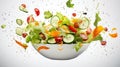 Vegetable salad in a bowl with flying ingredients and drops of olive oil Royalty Free Stock Photo