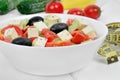 Vegetable salad in a bowl on a wood table with centimeter Royalty Free Stock Photo