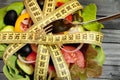Vegetable salad with centimeter and fork Royalty Free Stock Photo