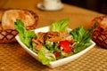 Vegetable salad with crackers, served on a white plate. Beijing, China.