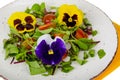 Vegetable salad with edible flowers on white background Royalty Free Stock Photo