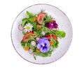 Vegetable salad with edible flowers on white background Royalty Free Stock Photo