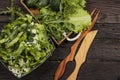 Vegetable salad with fresh vegetables and arugula on a wooden table. Salad with green fresh vegetables in a glass bowl. Vegetarian Royalty Free Stock Photo