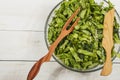 Vegetable salad with fresh vegetables on a wooden table. Salad with green fresh vegetables in a glass bowl. Vegetarian food salad. Royalty Free Stock Photo