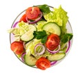 Vegetable salad in glass plate on a white isolated. The view from the top.