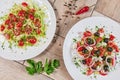 Vegetable Salad. Gray plate. Wooden light background. Free space for text. Salad of cucumbers, tomato and cabbage. Royalty Free Stock Photo