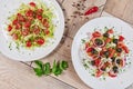 Vegetable Salad. Gray plate. Wooden light background. Free space for text. Salad of cucumbers, tomato and cabbage. Royalty Free Stock Photo