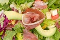 Vegetable salad with lettuce, avocado and jamon, fragment close-up Royalty Free Stock Photo