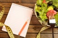 Vegetable salad and notepad Royalty Free Stock Photo