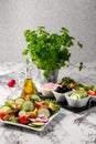 Vegetable salad and Olive oil in a bottle. Fresh chopped vegetables in a salad bowl. Healthy eating. Vegetarian food Royalty Free Stock Photo