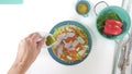 Vegetable salad on a plate, close up on white background. Fresh organic romaine lettuce, red pepper, onion, some seasoning, and ol Royalty Free Stock Photo