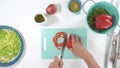 Vegetable salad on a plate, close up on white background. Fresh organic romaine lettuce, red pepper, onion, some seasoning, and ol Royalty Free Stock Photo