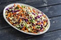 Vegetable salad with red cabbage, carrots, sweet peppers, herbs and seeds. Royalty Free Stock Photo
