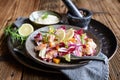 Vegetable salad with red and white chicory, baked trout pieces, onion and roasted Hokkaido squash